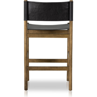 Kena Counter Stool by Four Hands. Made from solid parawood, top grain leather in a modern style.