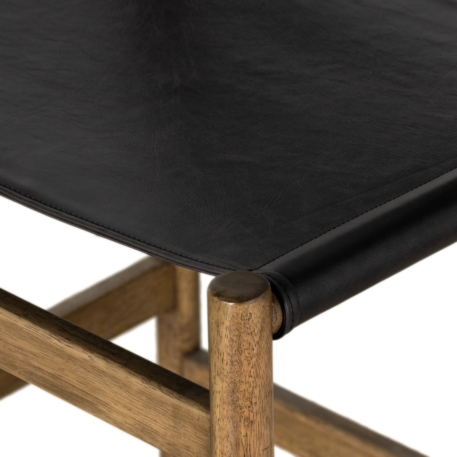 Kena Counter Stool by Four Hands. Made from solid parawood, top grain leather in a modern style.