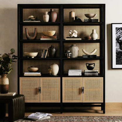 Caprice Wide Bookshelf by Four Hands in natural mango, gunmetal, natural cane and natural mango. Made from solid mango, iron in a modern style.