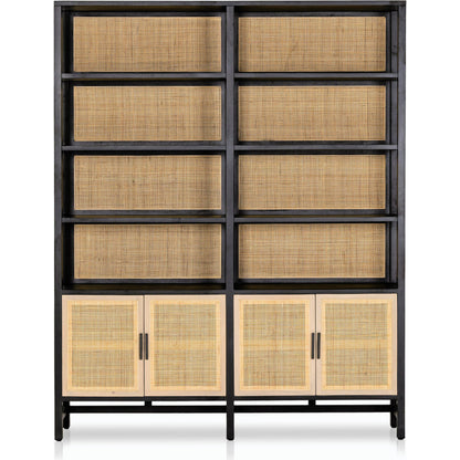 Caprice Wide Bookshelf by Four Hands in natural mango, gunmetal, natural cane and natural mango. Made from solid mango, iron in a modern style.