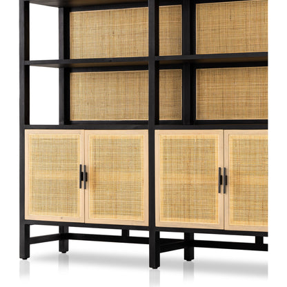 Caprice Wide Bookshelf by Four Hands in natural mango, gunmetal, natural cane and natural mango. Made from solid mango, iron in a modern style.
