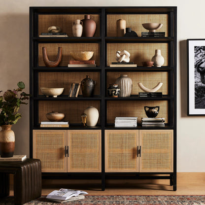 Caprice Wide Bookshelf by Four Hands in natural mango, gunmetal, natural cane and natural mango. Made from solid mango, iron in a modern style.