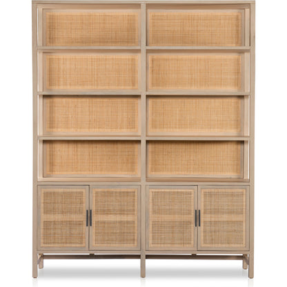 Caprice Wide Bookshelf by Four Hands in natural mango, gunmetal, natural cane and natural mango. Made from solid mango, iron in a modern style.