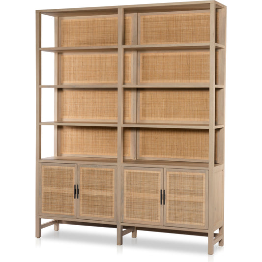 Caprice Wide Bookshelf by Four Hands in natural mango, gunmetal, natural cane and natural mango. Made from solid mango, iron in a modern style.