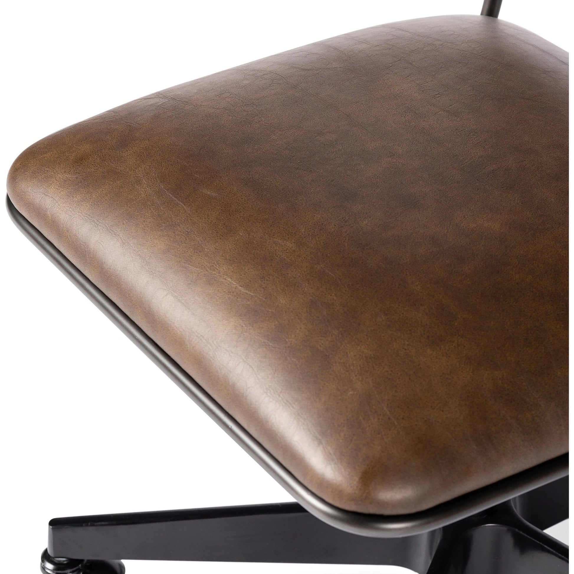 Wharton Desk Chair by Four Hands in distressed brown. Made from faux leather, iron in a modern style.