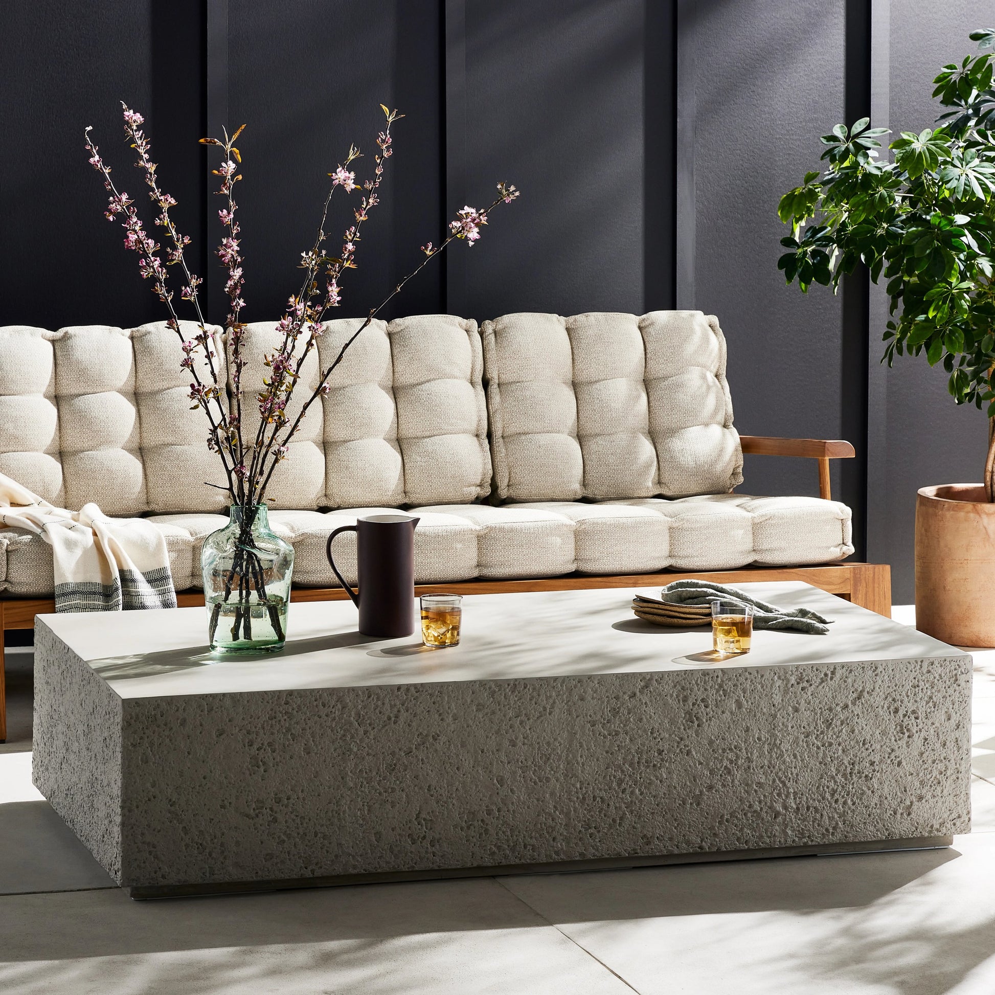 Otero Rectangular Outdoor Coffee Table by Four Hands. Made from concrete in a modern style.