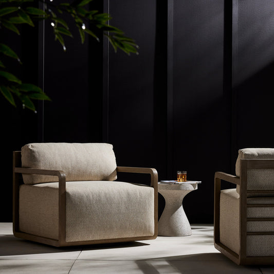 Stroud Outdoor Swivel Chair by Four Hands in faye sand, washed brown. Made from 100% olefin, solid fsc®-certified teak, 59% polyurethane foam, 30% polyester fiber, 11% polyester fiber batting in a modern style.
