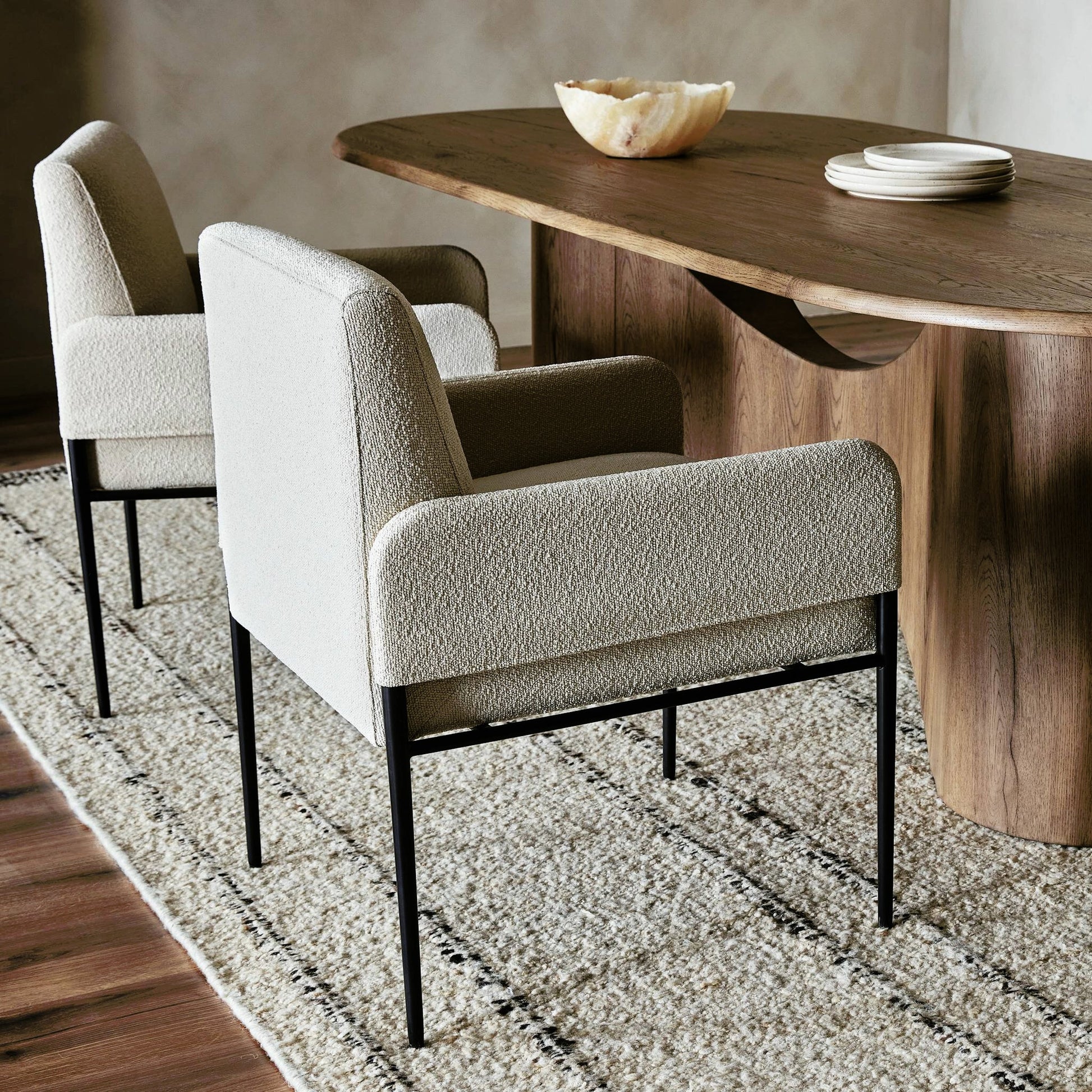 Brickel Dining Armchair by Four Hands in light taupe. Made from 100% polyester, iron, 93% polyurethane foam pad, 7% polyester fiber batting in a modern style.