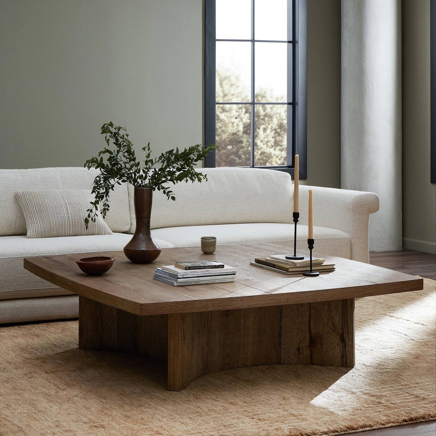 013 SI-2137241 | Lifestyle | Brinton Square Coffee Table by Four Hands in rustic oak. Made from thick oak veneer, engineered hardwood in a modern style.