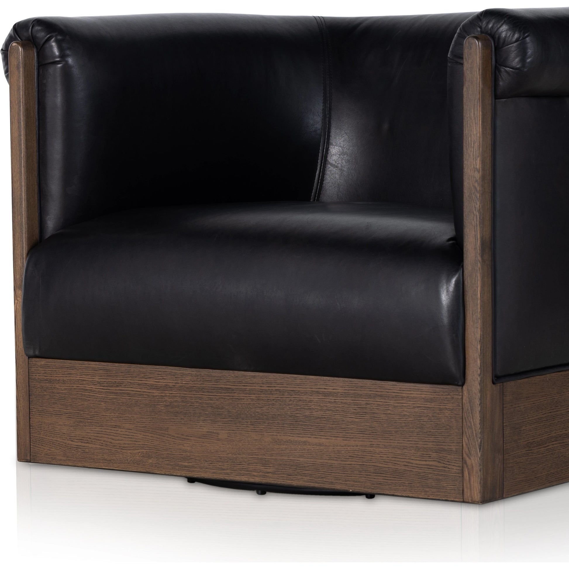 Colby Swivel Chair by Four Hands in vintage ash veneer, heirloom black, vintage ash. Made from top grain leather, ash veneer, solid ash in a modern style.