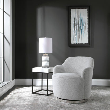 Hobart Casual Swivel Chair by Uttermost. Made from plywood, stainless steel, fabric, foam in a modern style.