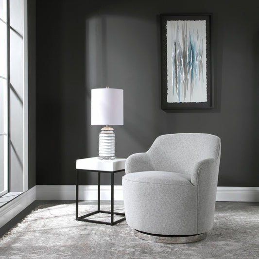 Hobart Casual Swivel Chair by Uttermost. Made from plywood, stainless steel, fabric, foam in a modern style.