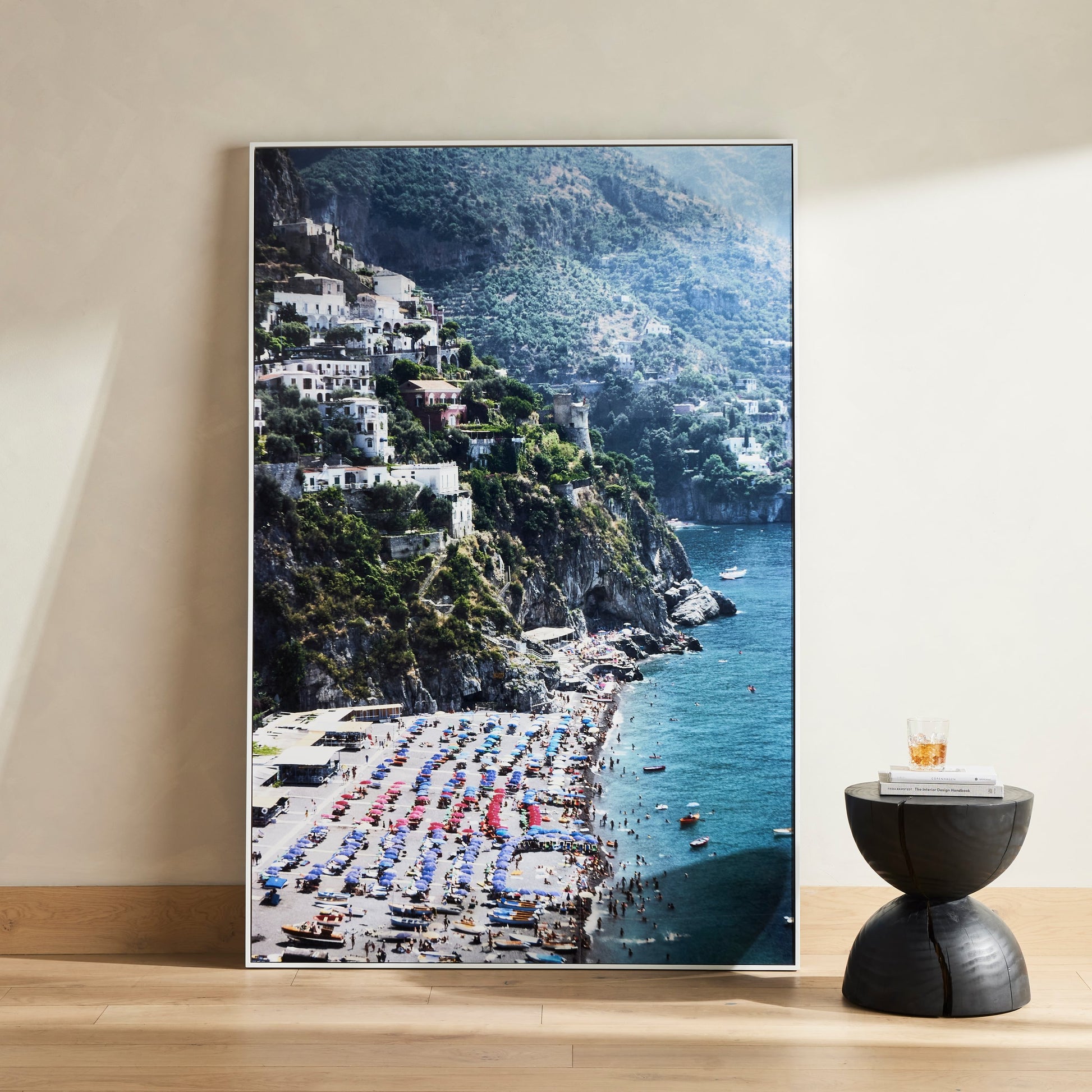 Beach in Positano by Slim Aarons by Four Hands. Made from gloss white chromaluxe in a coastal style.