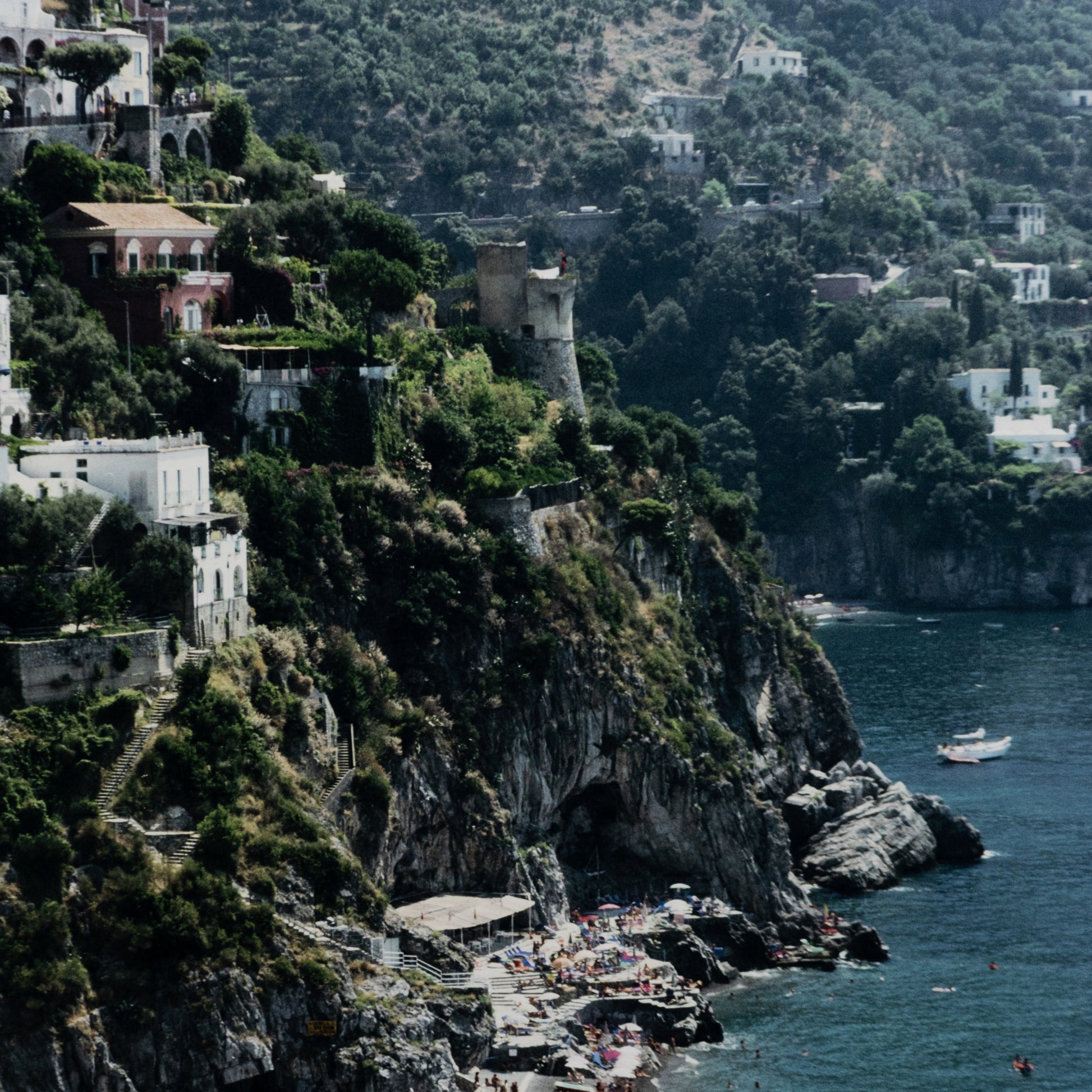 Beach in Positano by Slim Aarons by Four Hands. Made from gloss white chromaluxe in a coastal style.