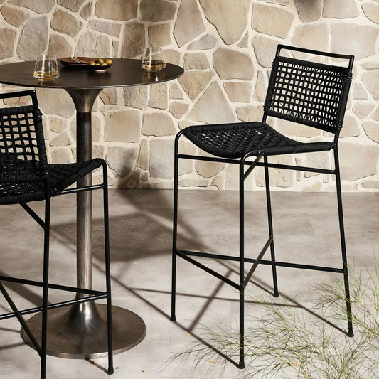 Wharton Outdoor Counter Stool by Four Hands in satin black. Made from iron, 100% polyester in a modern style.
