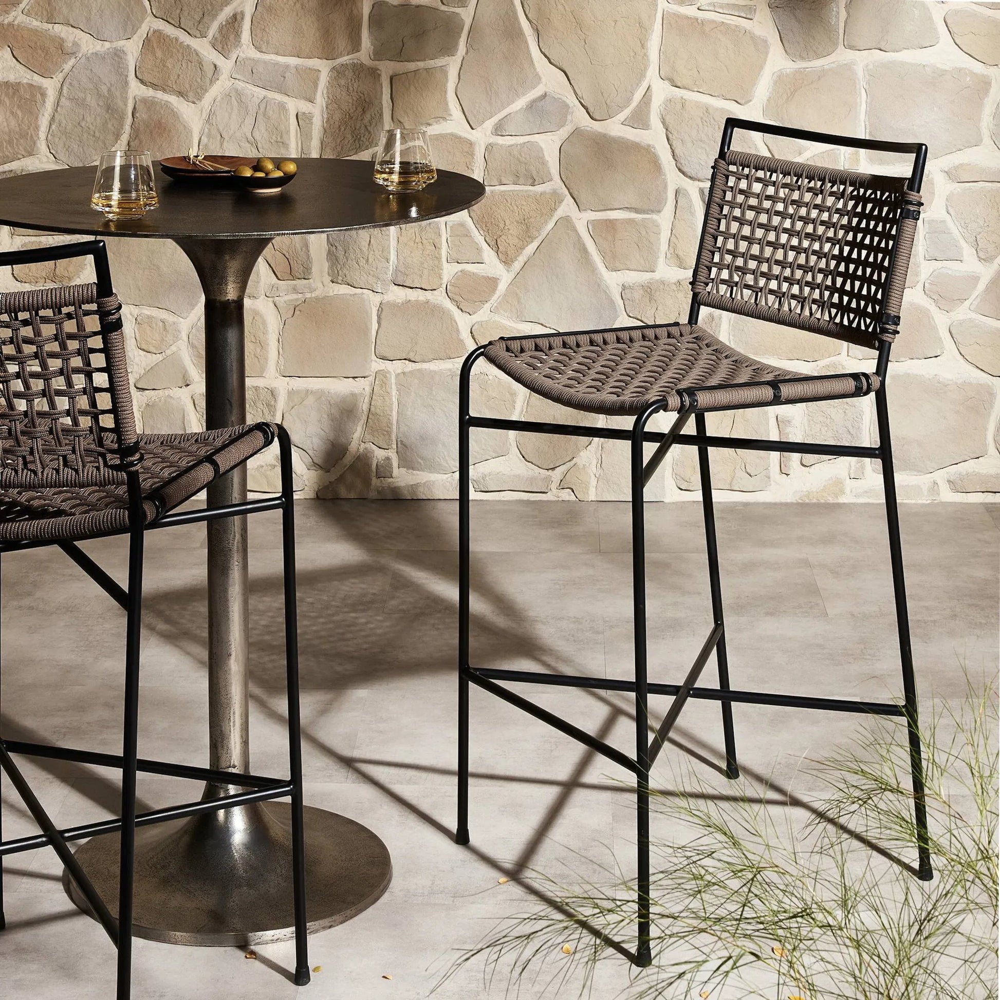 Wharton Outdoor Counter Stool by Four Hands in earth rope and satin black. Made from iron, 100% polyester in a modern style.