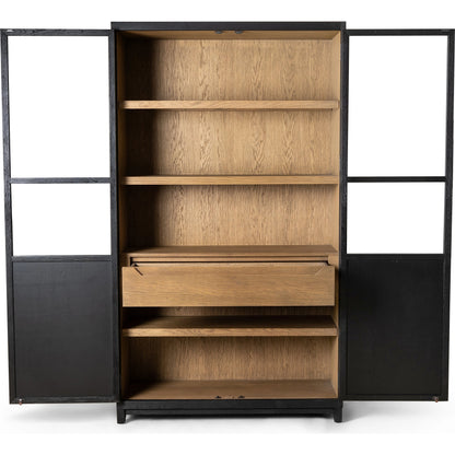 Millie Panel & Glass Door Cabinet by Four Hands in drifted matte black. Made from solid oak, oak veneer in a modern style.