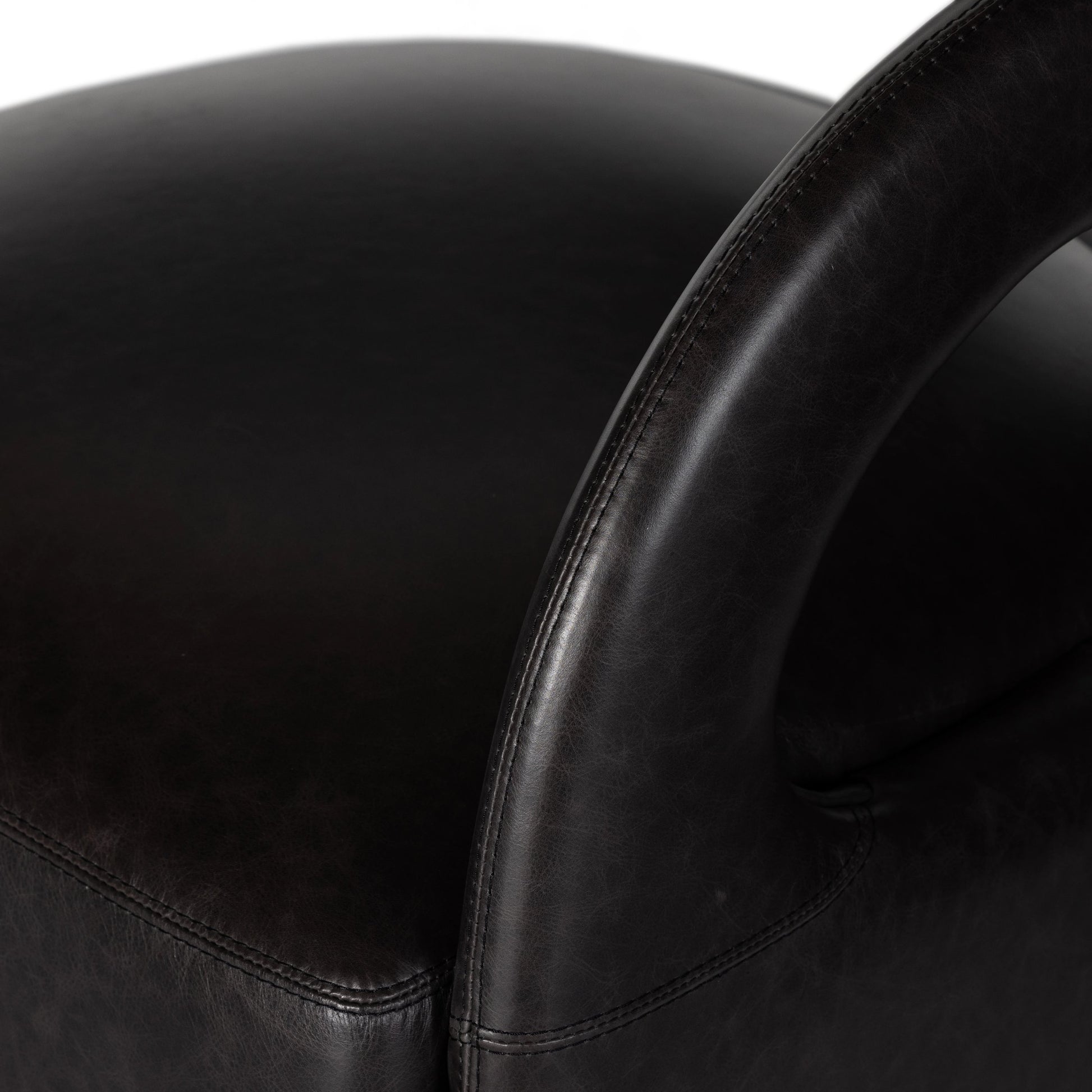 Hawkins Swivel Chair by Four Hands in sonoma butterscotch. Made from top grain leather, poplar plywood, 100% polyester in a modern style.