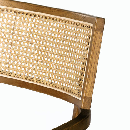 Britt Dining Armchair by Four Hands. Made from 92% polyester, 8% flax, linen, solid nettlewood, cane in a modern style.