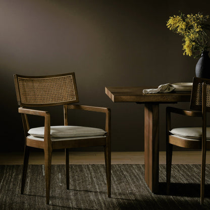 Britt Dining Armchair by Four Hands. Made from 92% polyester, 8% flax, linen, solid nettlewood, cane in a modern style.