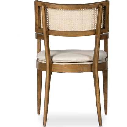Britt Dining Armchair by Four Hands. Made from 92% polyester, 8% flax, linen, solid nettlewood, cane in a modern style.