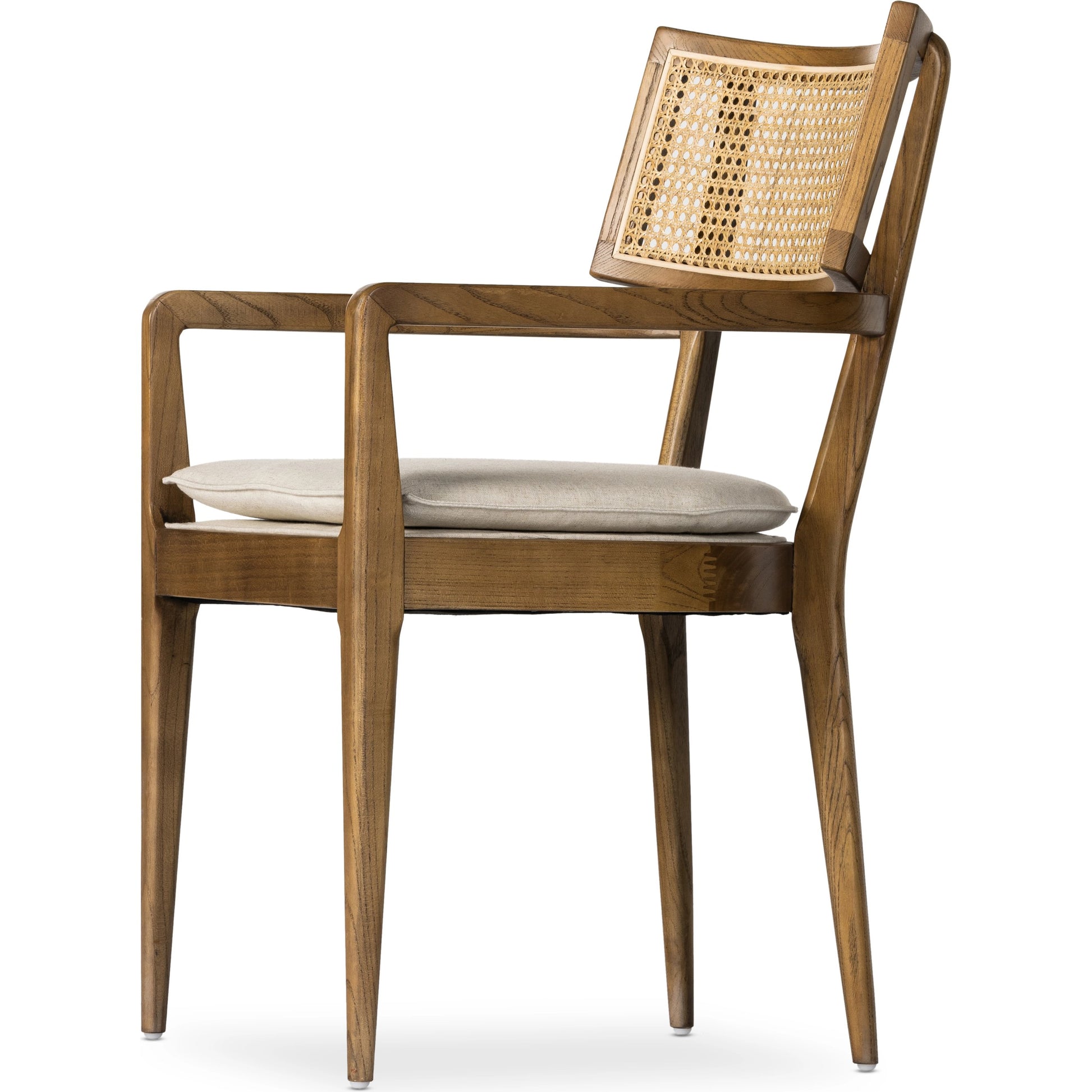 Britt Dining Armchair by Four Hands. Made from 92% polyester, 8% flax, linen, solid nettlewood, cane in a modern style.