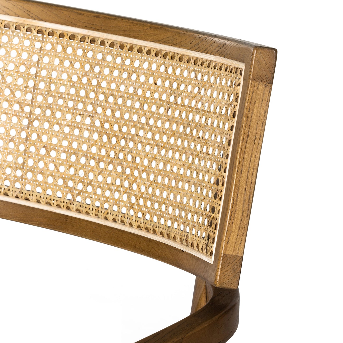 021 SI-1980147 | Closeup | Britt Dining Armchair by Four Hands in natural cane, toasted nettlewood, savile flax. Made from 92% polyester, 8% flax, linen, solid nettlewood, cane in a modern style.