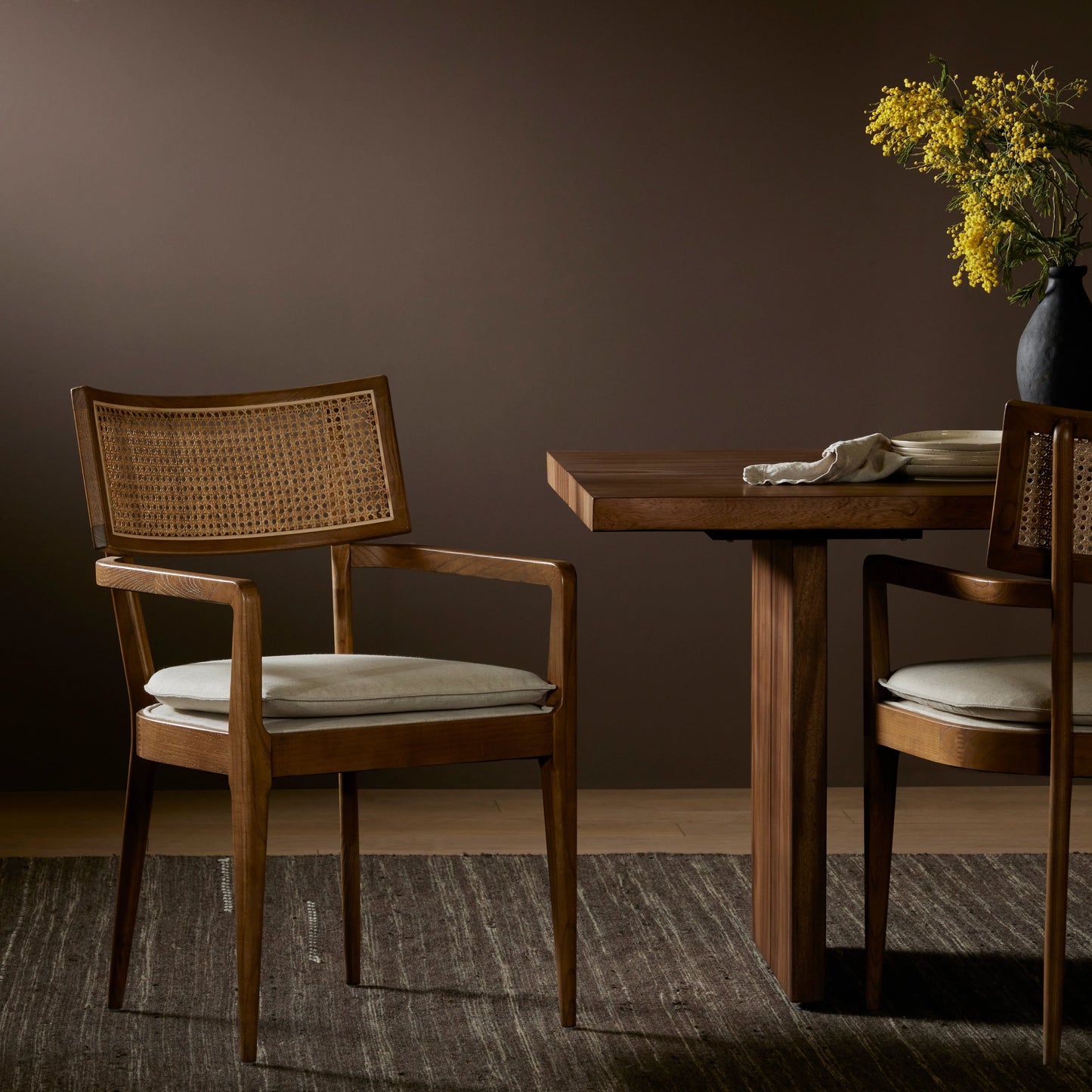 014 SI-1980147 | Lifestyle | Britt Dining Armchair by Four Hands in natural cane, toasted nettlewood, savile flax. Made from 92% polyester, 8% flax, linen, solid nettlewood, cane in a modern style.