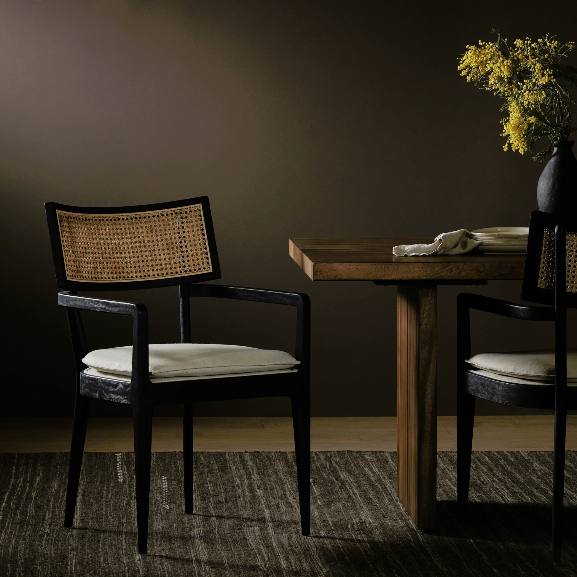 Britt Dining Armchair by Four Hands. Made from 92% polyester, 8% flax, linen, solid nettlewood, cane in a modern style.