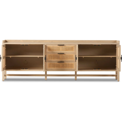 Caprice 96" Sideboard by Four Hands in natural mango. Made from solid mango, iron, cane in a modern style.