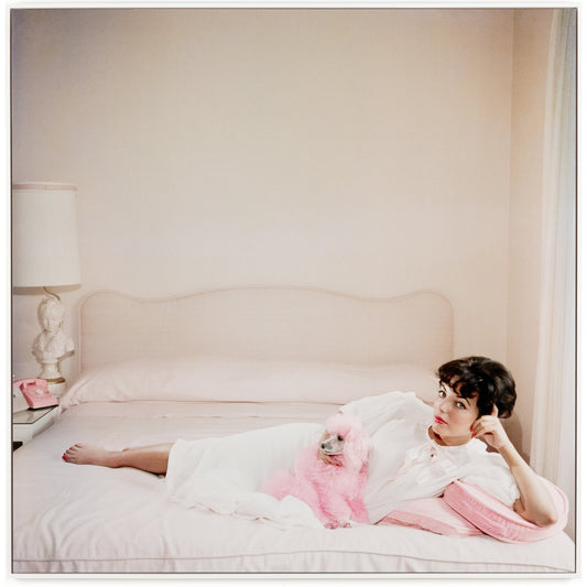 Joan Collins Relaxes by Slim Aarons by Four Hands. Made from gloss white chromaluxe in a transitional style.
