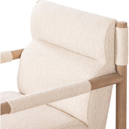 Kiano Dining Armchair by Four Hands in charter oatmeal and washed natural parawood. Made from 69% polyester, 23% acrylic, 8% flax, linen, solid parawood, 100% polyester in a modern style.