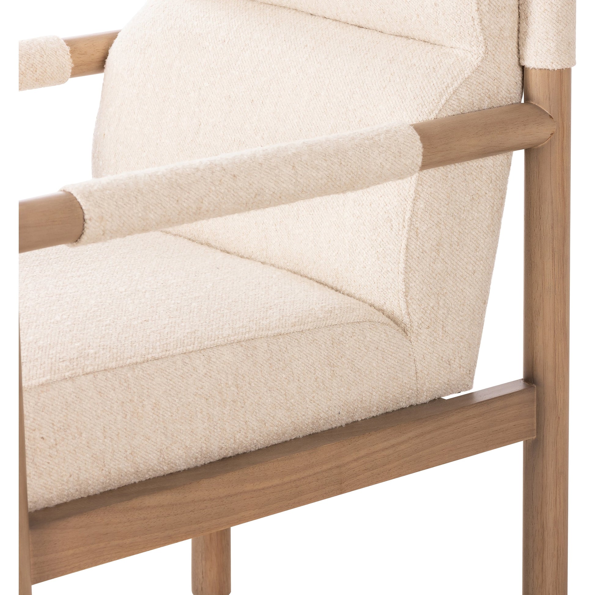 Kiano Dining Armchair by Four Hands in charter oatmeal and washed natural parawood. Made from 69% polyester, 23% acrylic, 8% flax, linen, solid parawood, 100% polyester in a modern style.