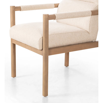 Kiano Dining Armchair by Four Hands in charter oatmeal and washed natural parawood. Made from 69% polyester, 23% acrylic, 8% flax, linen, solid parawood, 100% polyester in a modern style.
