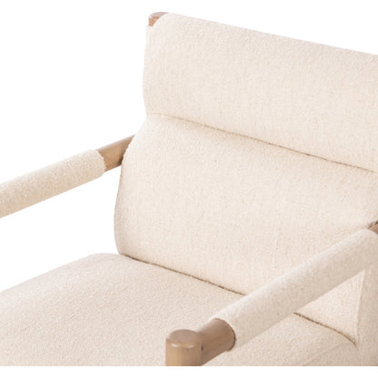 Kiano Dining Armchair by Four Hands in charter oatmeal and washed natural parawood. Made from 69% polyester, 23% acrylic, 8% flax, linen, solid parawood, 100% polyester in a modern style.