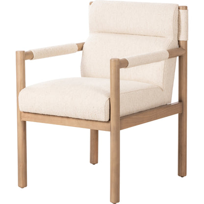 Kiano Dining Armchair by Four Hands in charter oatmeal and washed natural parawood. Made from 69% polyester, 23% acrylic, 8% flax, linen, solid parawood, 100% polyester in a modern style.