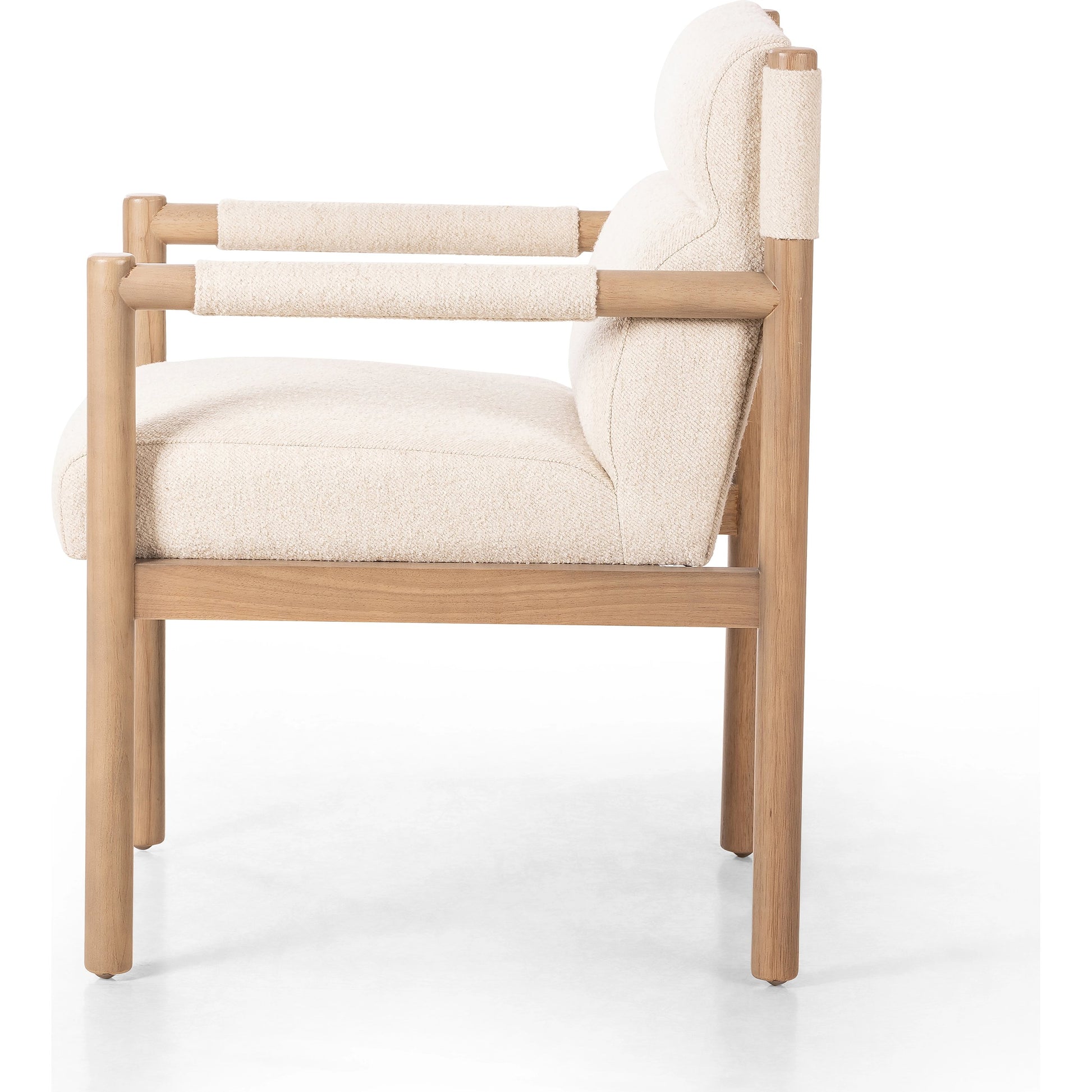 Kiano Dining Armchair by Four Hands in charter oatmeal and washed natural parawood. Made from 69% polyester, 23% acrylic, 8% flax, linen, solid parawood, 100% polyester in a modern style.