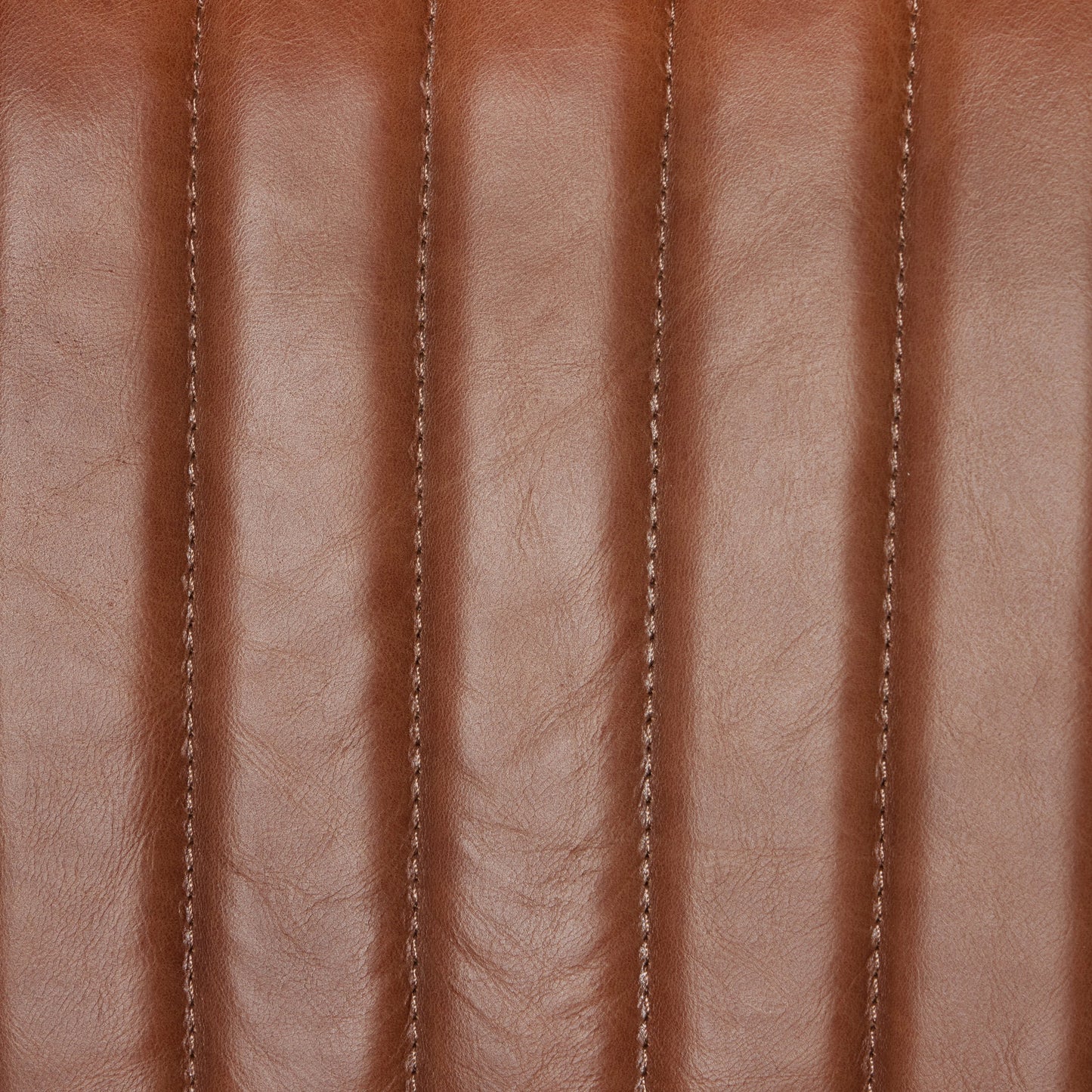 007 SI-2000917 | Closeup | Alice Counter Stool by Four Hands in chestnut. Made from top grain leather, solid beech, 100% polyester in a modern style.