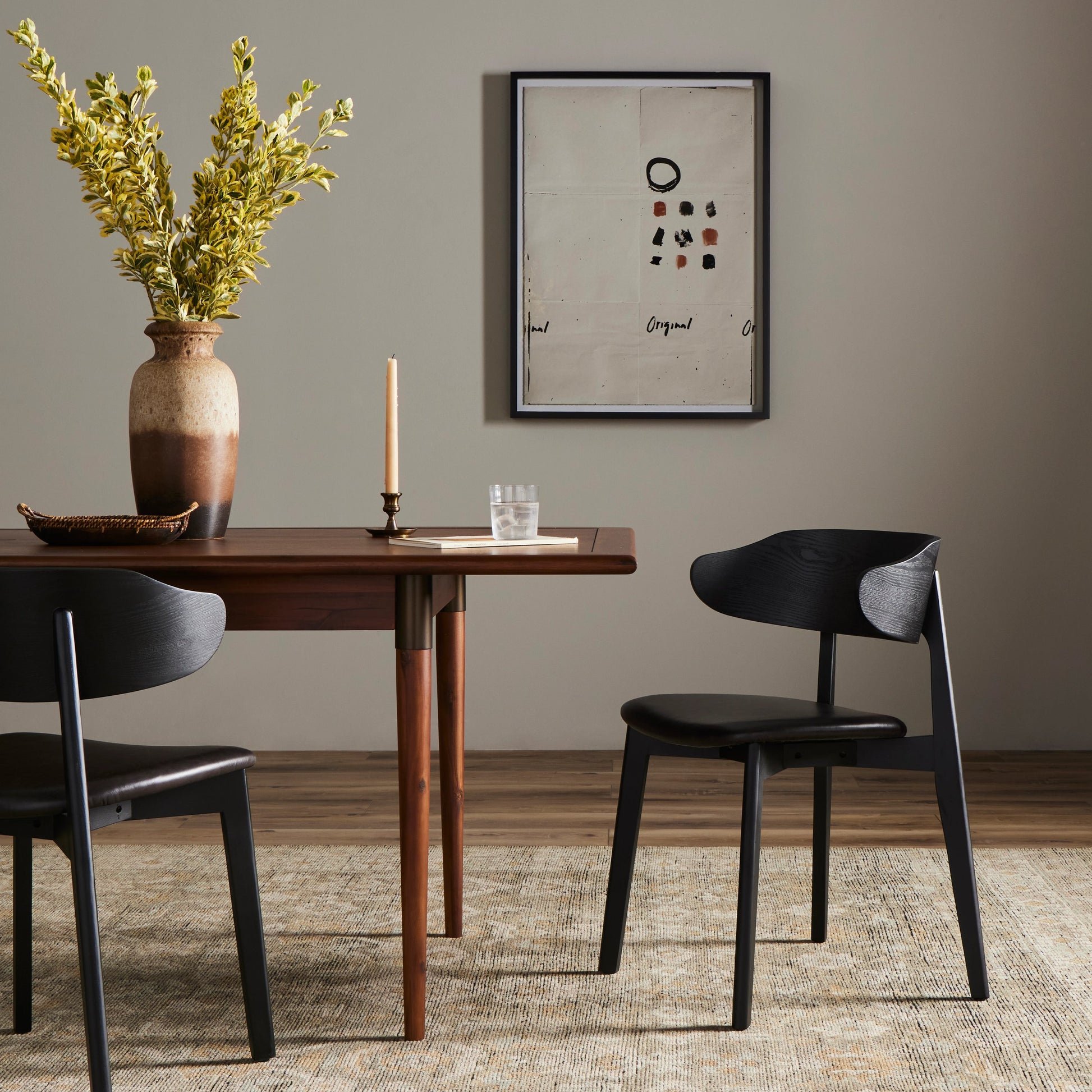 Franco Upholstered Dining Chair by Four Hands in sonoma black and black. Made from top grain leather, solid ash, ash veneer in a modern style.
