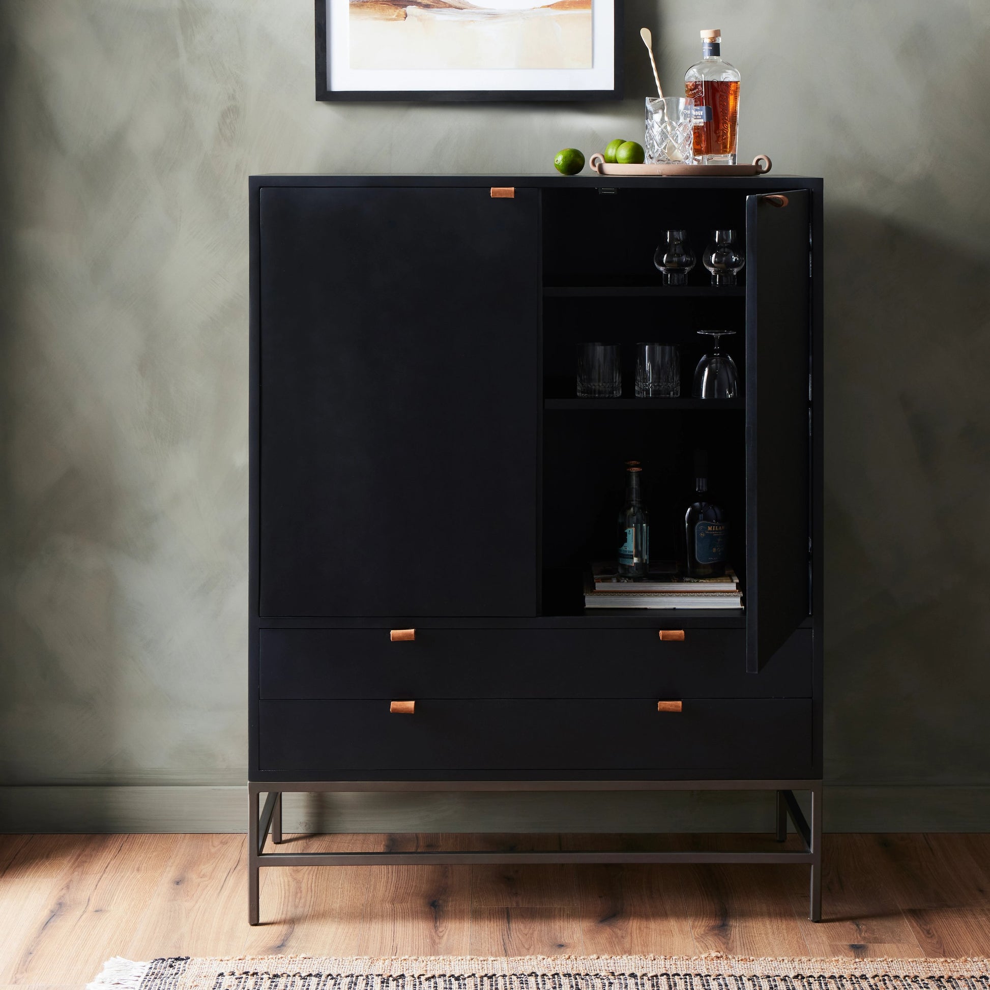 Trey Bar Cabinet by Four Hands in black wash poplar, toffee leather. Made from solid poplar, top grain leather in a modern style.