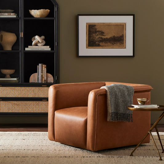 Wellborn Swivel Chair by Four Hands in palermo cognac. Made from top grain leather, poplar plywood, 100% polyester in a modern style.