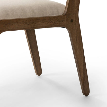 Norwalk Dining Chair by Four Hands in savile flax, lamont oak, antique brass. Made from 92% polyester, 8% flax/linen, solid oak, stainless steel in a unique style.