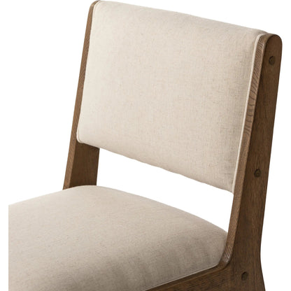 Norwalk Dining Chair by Four Hands in savile flax, lamont oak, antique brass. Made from 92% polyester, 8% flax/linen, solid oak, stainless steel in a unique style.