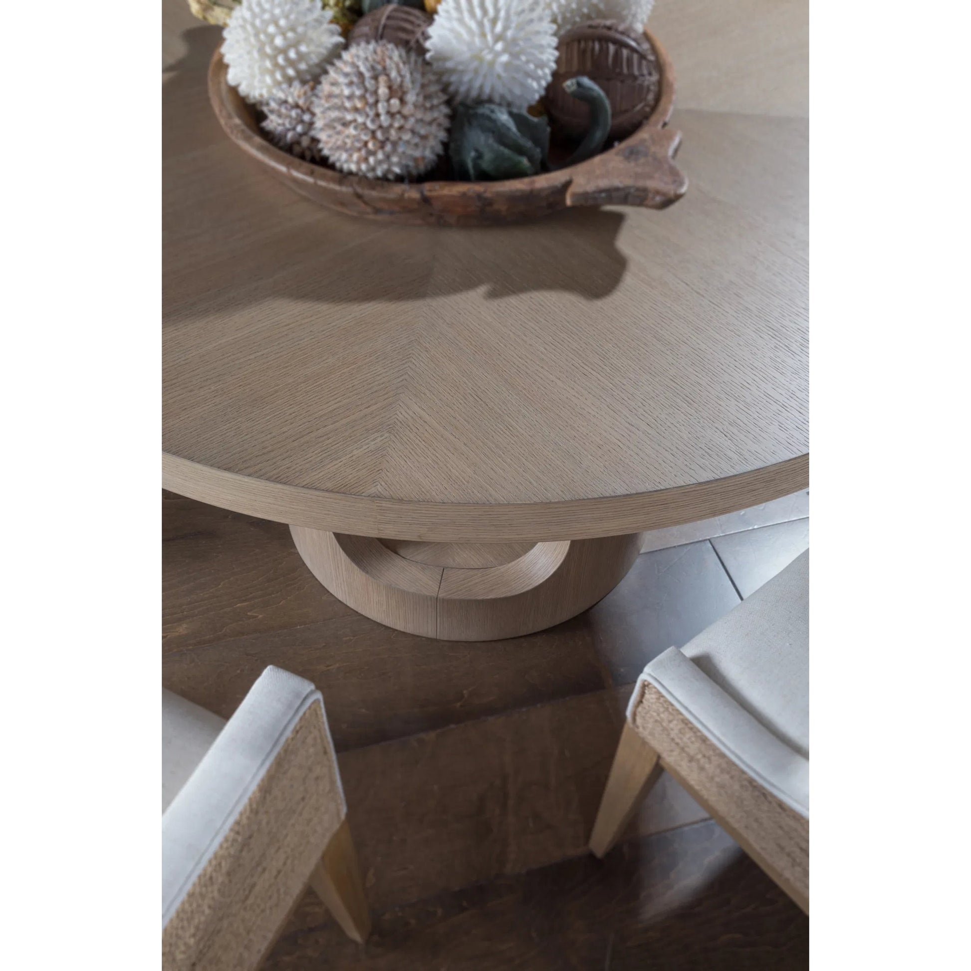 Simpatico Round Dining Table by Artistica Home in white oak. Made from white oak in a unique style.
