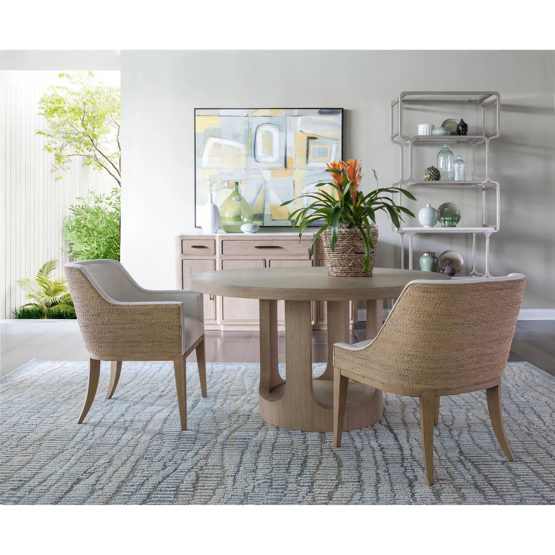 Simpatico Round Dining Table by Artistica Home in white oak. Made from white oak in a unique style.