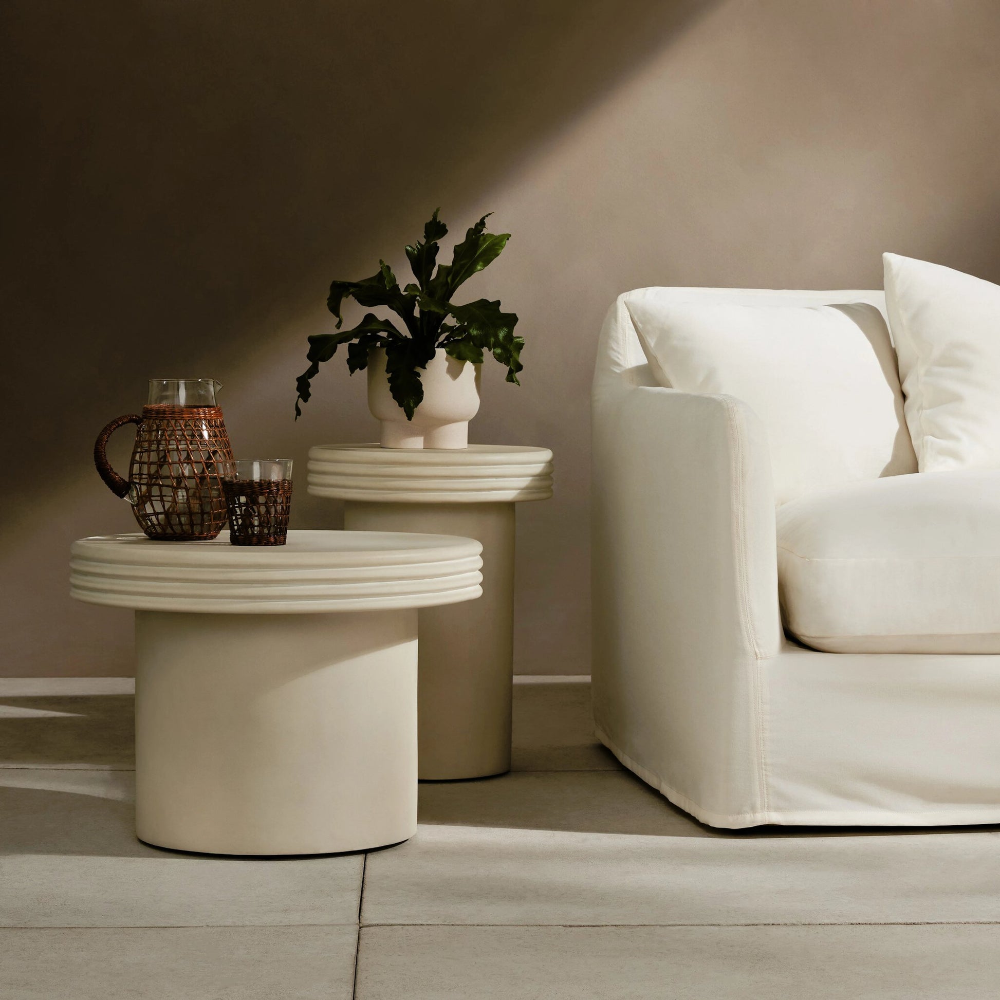 Grecia Outdoor End Table Set by Four Hands in white. Made from concrete in a modern style.