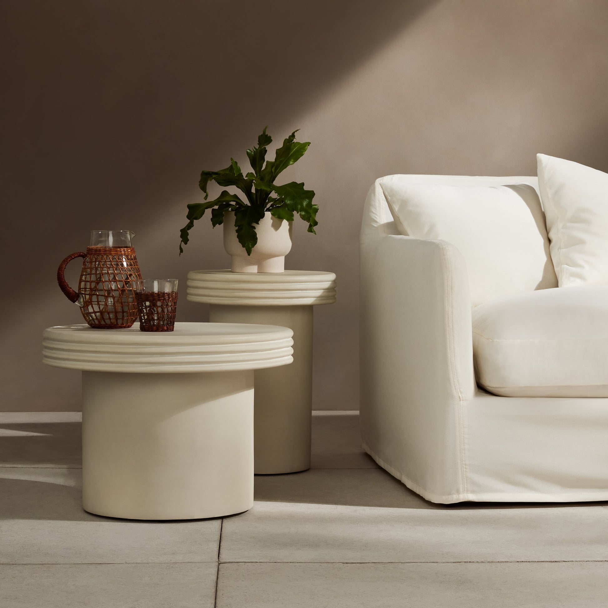 Grecia Outdoor End Table Set by Four Hands in white. Made from concrete in a modern style.
