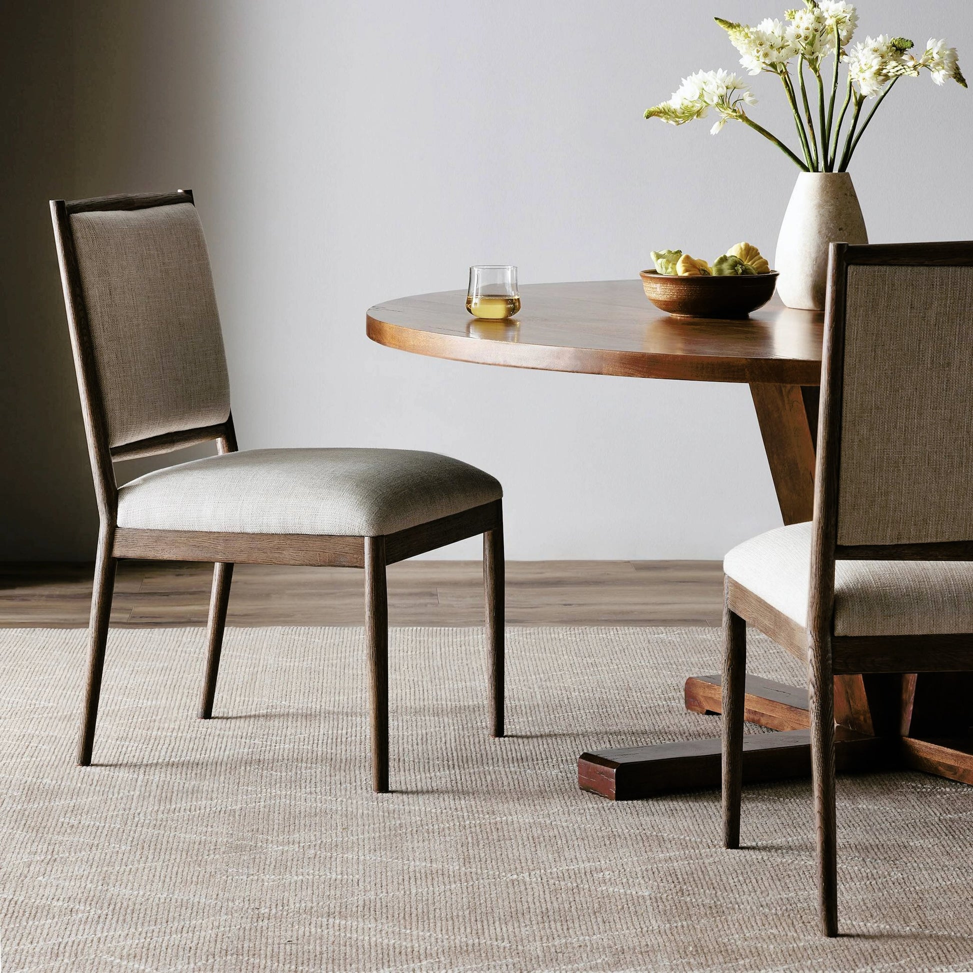Glenview Dining Chair by Four Hands in essence natural and weathered oak. Made from 49% viscose (rayon), 22% flax, linen, 18% polyester, 11% cotton, solid oak in a modern style.