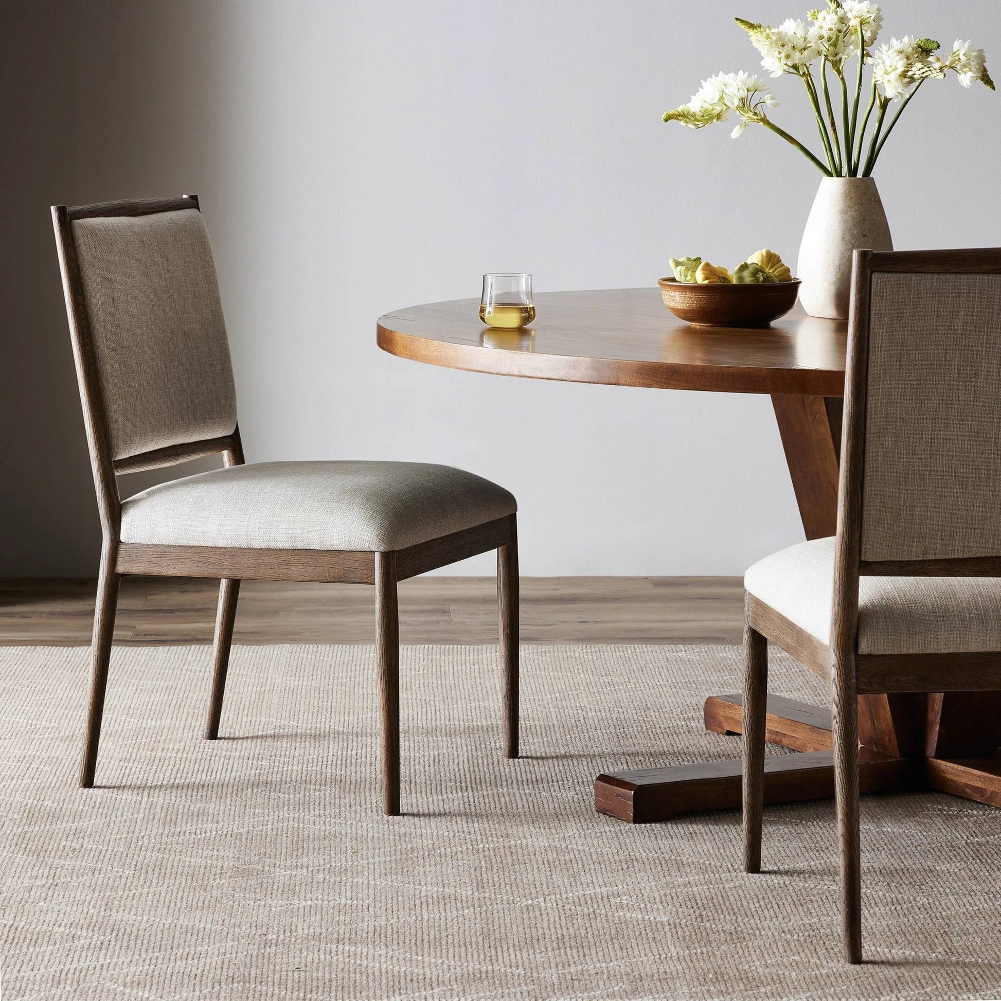 Glenview Dining Chair by Four Hands in essence natural and weathered oak. Made from 49% viscose (rayon), 22% flax, linen, 18% polyester, 11% cotton, solid oak in a modern style.