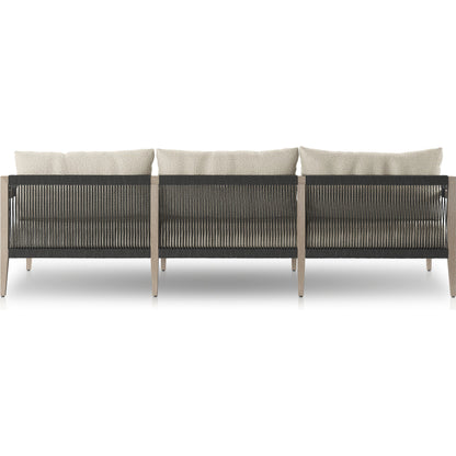 Sherwood Outdoor Sofa, Weathered Grey by Four Hands. Made from 100% olefin, solid fsc®-certified teak, 100% polypropylene in a coastal style.